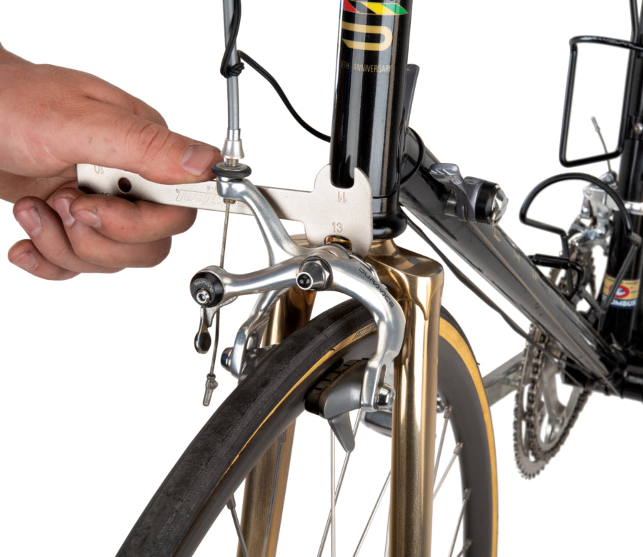Park Tool OBW-4 adjusting a dual-pivot brake