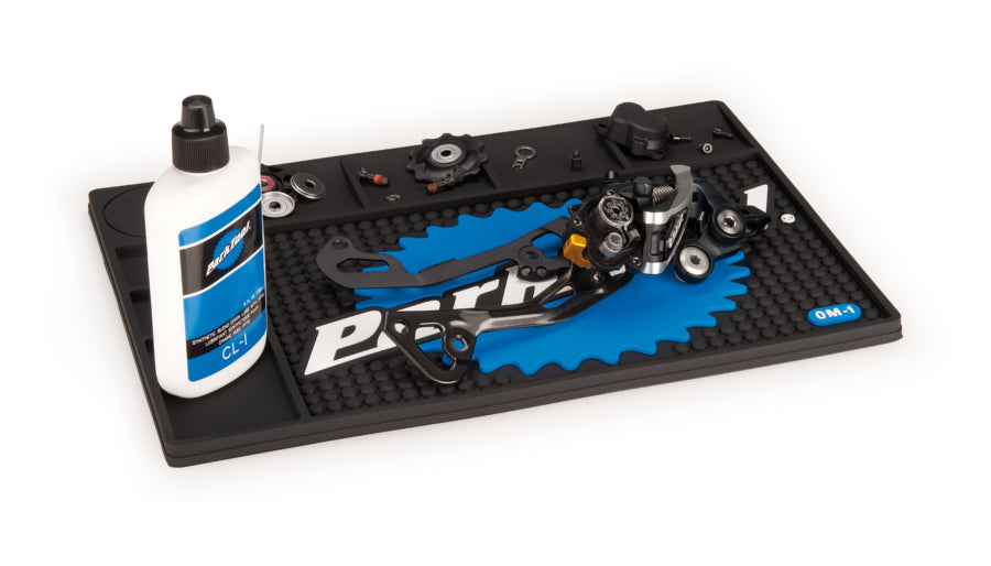 Park Tool OM-1 with tools and parts laid out on it